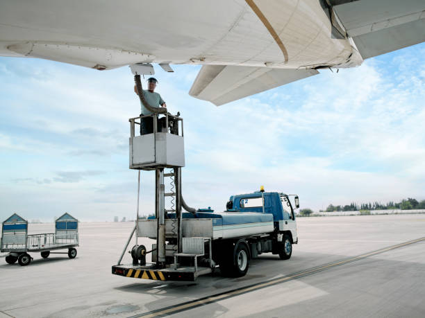 service worker working on an airplane on airport platform