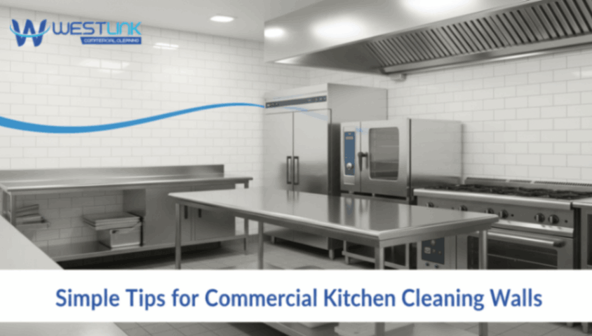 Spotless commercial kitchen with clean stainless-steel appliances and walls.