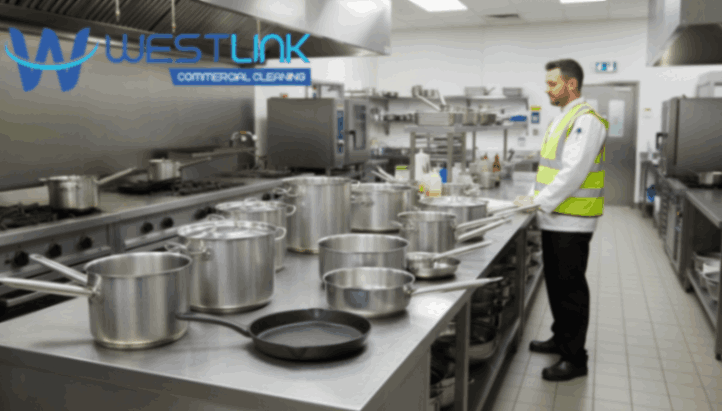 Variety of commercial kitchen cookware on countertop.