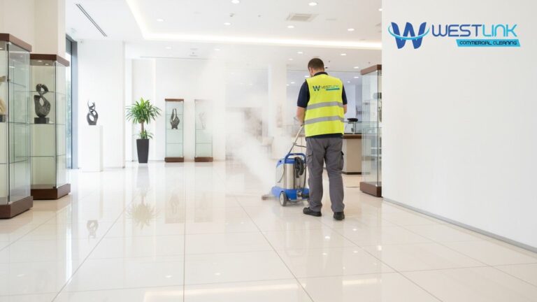 Commercial steam cleaning machine sanitizing showroom tile flooring.
