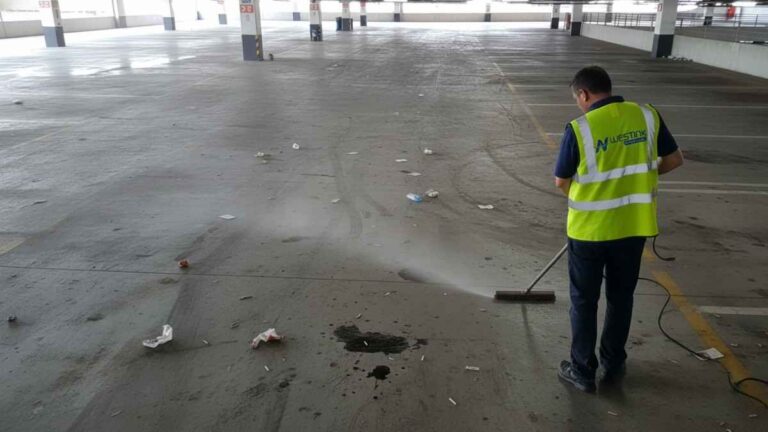 High-pressure cleaning of multi-level car parks and open parking lots in Sydney, removing tyre marks, oil drips, and litter stains from concrete, asphalt, and line-marked surfaces
