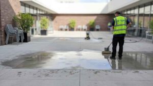 Cleaning of outdoor concrete areas such as courtyards, external walkways, and dining spaces to remove dirt and weather-related grime