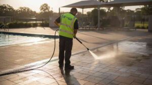 Commercial pool deck cleaned with high pressure in Sydney, showing slip-free, hygienic pavers, tiles, and concrete outdoor areas.