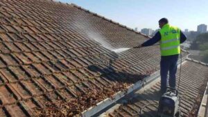 High-pressure cleaning of roofs and gutters in Sydney to remove mould, lichen, leaf debris, and stains, protecting tiles and membranes