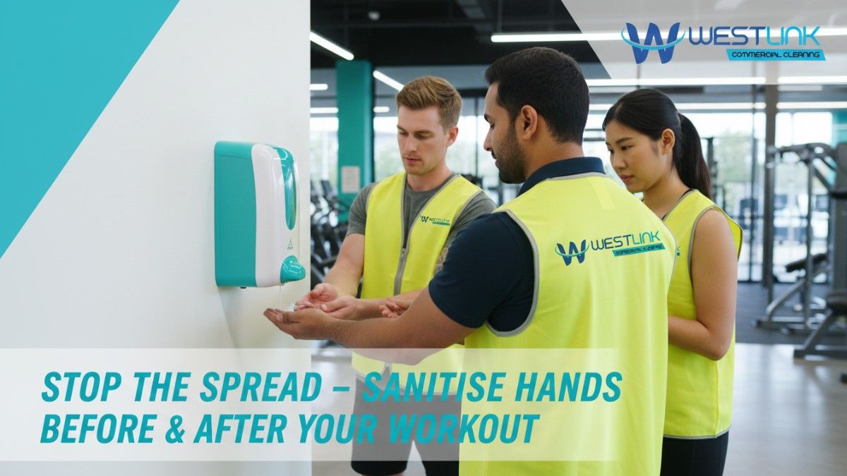 Three diverse gym members using a wall-mounted hand sanitiser station in a bright Australian gym.