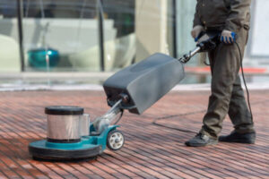Professional cleaner restoring the shine of polyurethane-sealed floors
