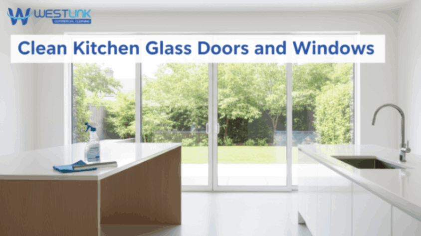 Spotless kitchen glass doors and windows with subtle cleaning tools nearby.