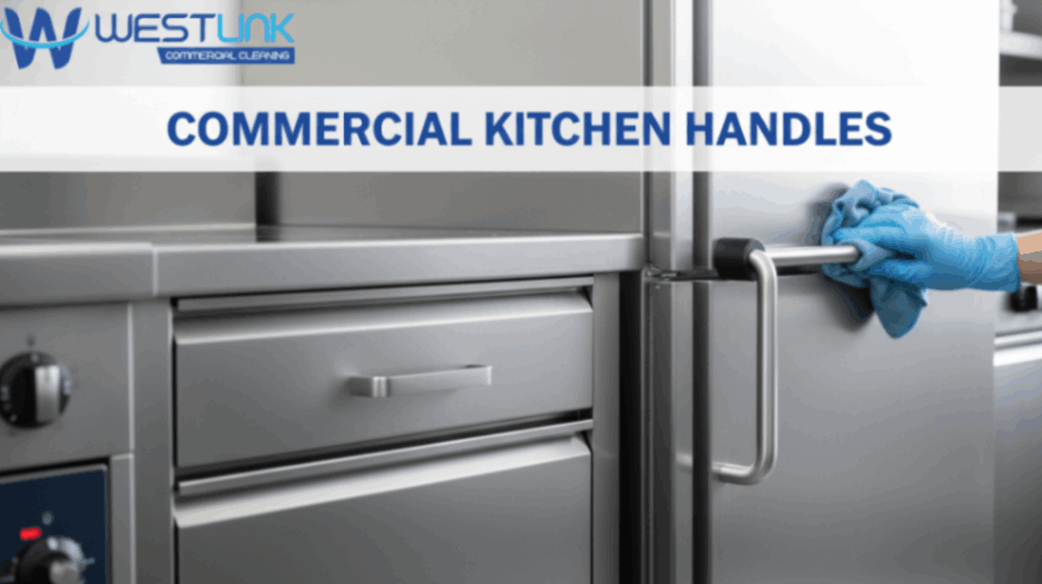 Close-up view of stainless steel commercial kitchen handles being cleaned with gloves.