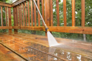 Our team cleaning waxed timber flooring with professional equipment