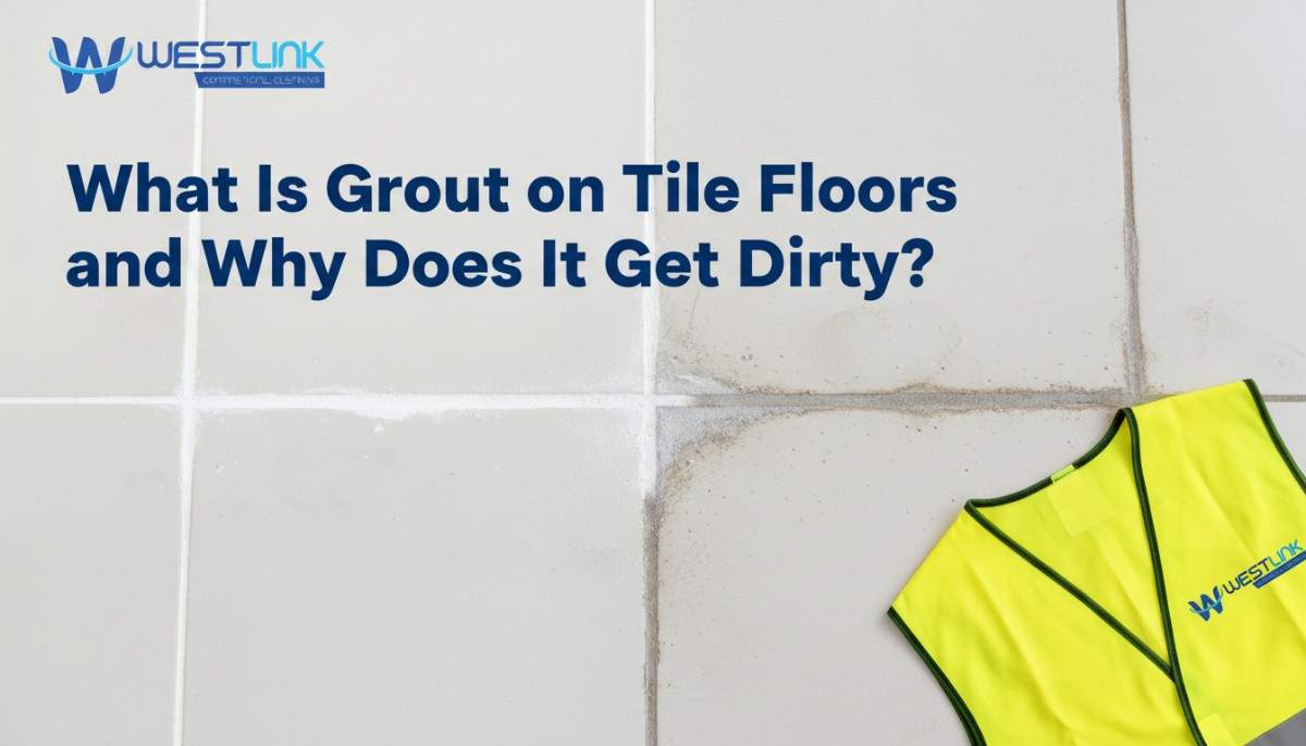 Close-up of tile grout lines showing a clean section beside stained, darkened grout on a floor.