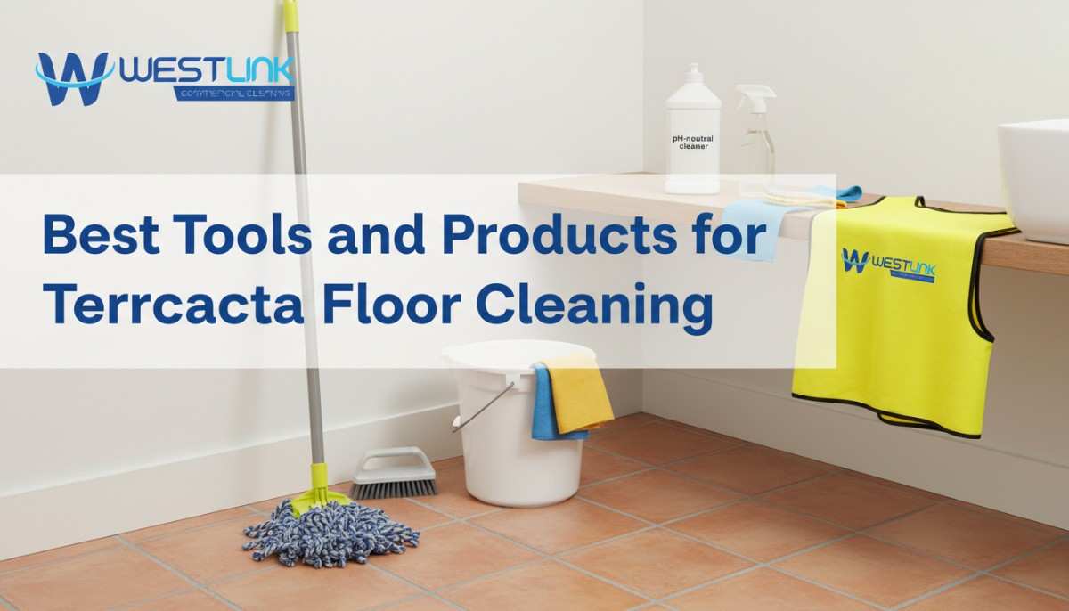 pH-neutral cleaner, microfiber mop, soft brush, and bucket arranged beside terracotta tiles