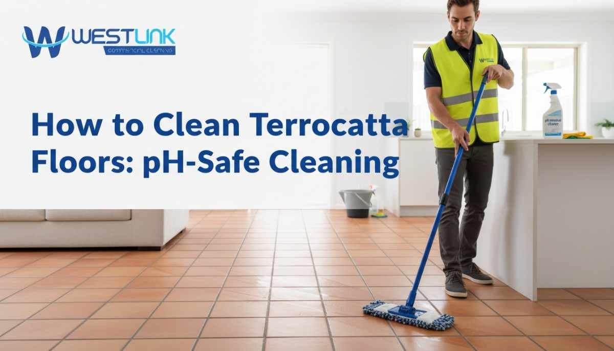 Person mopping terracotta tile floor with pH-neutral cleaner in a bright, modern home interior