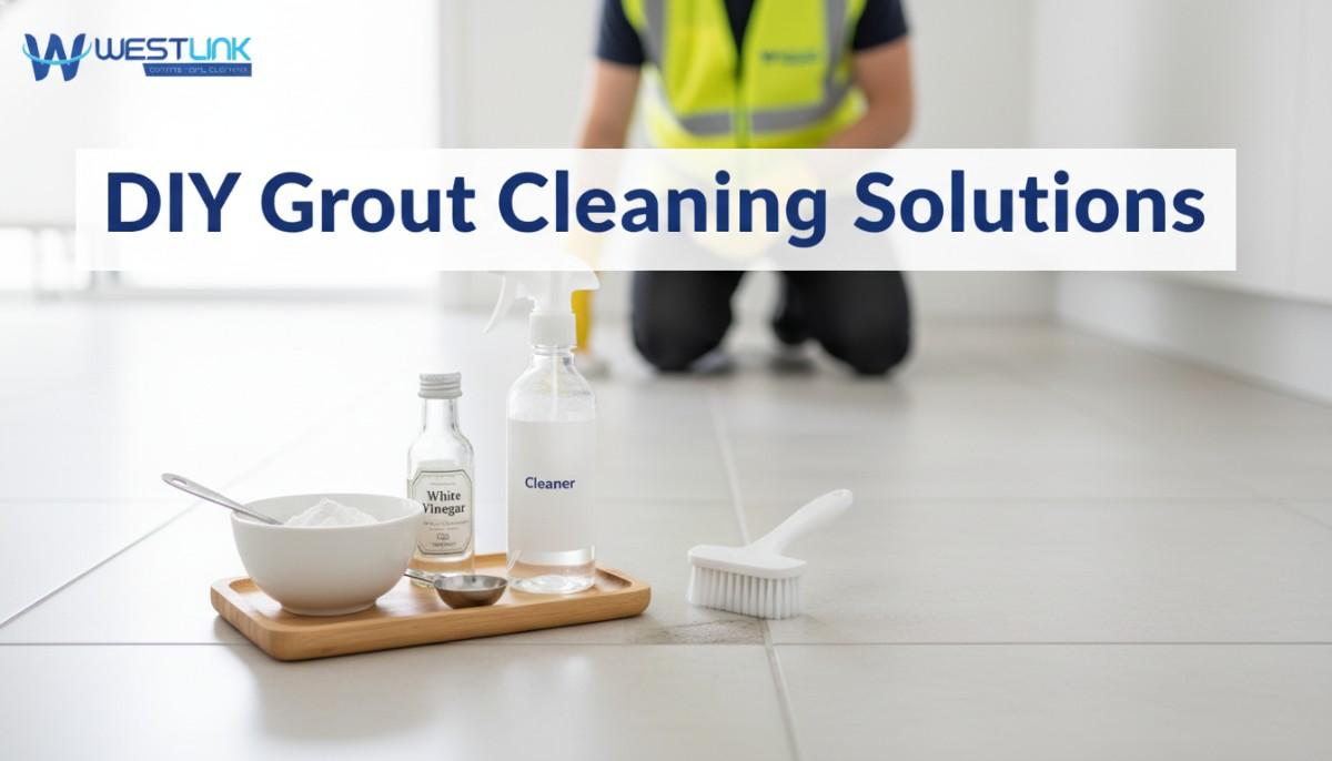Small bowls of baking soda and vinegar beside a spray bottle on tile, ready for grout cleaning.